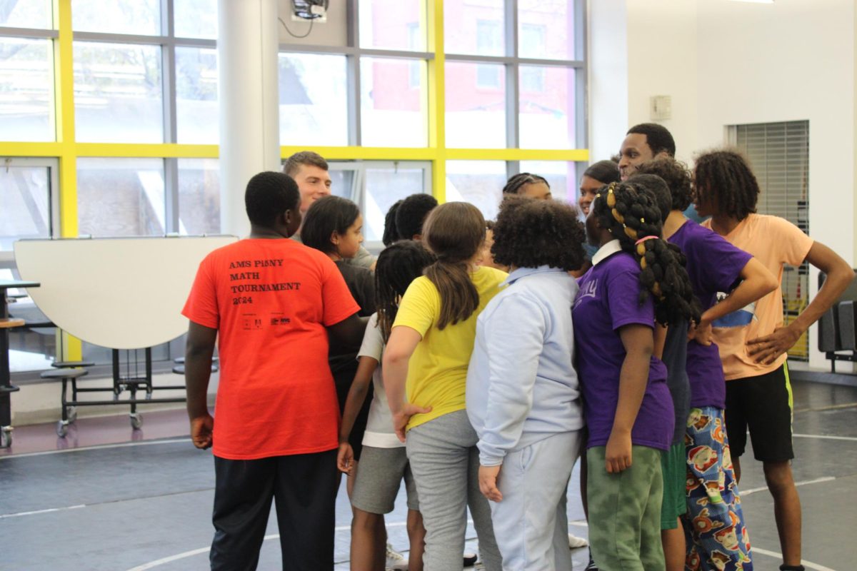 Coach Baker Leads the huddle of the newly-formed middle school team.  