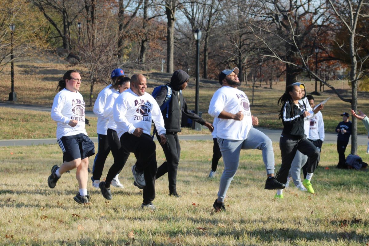 Staff warm up prior to the game.