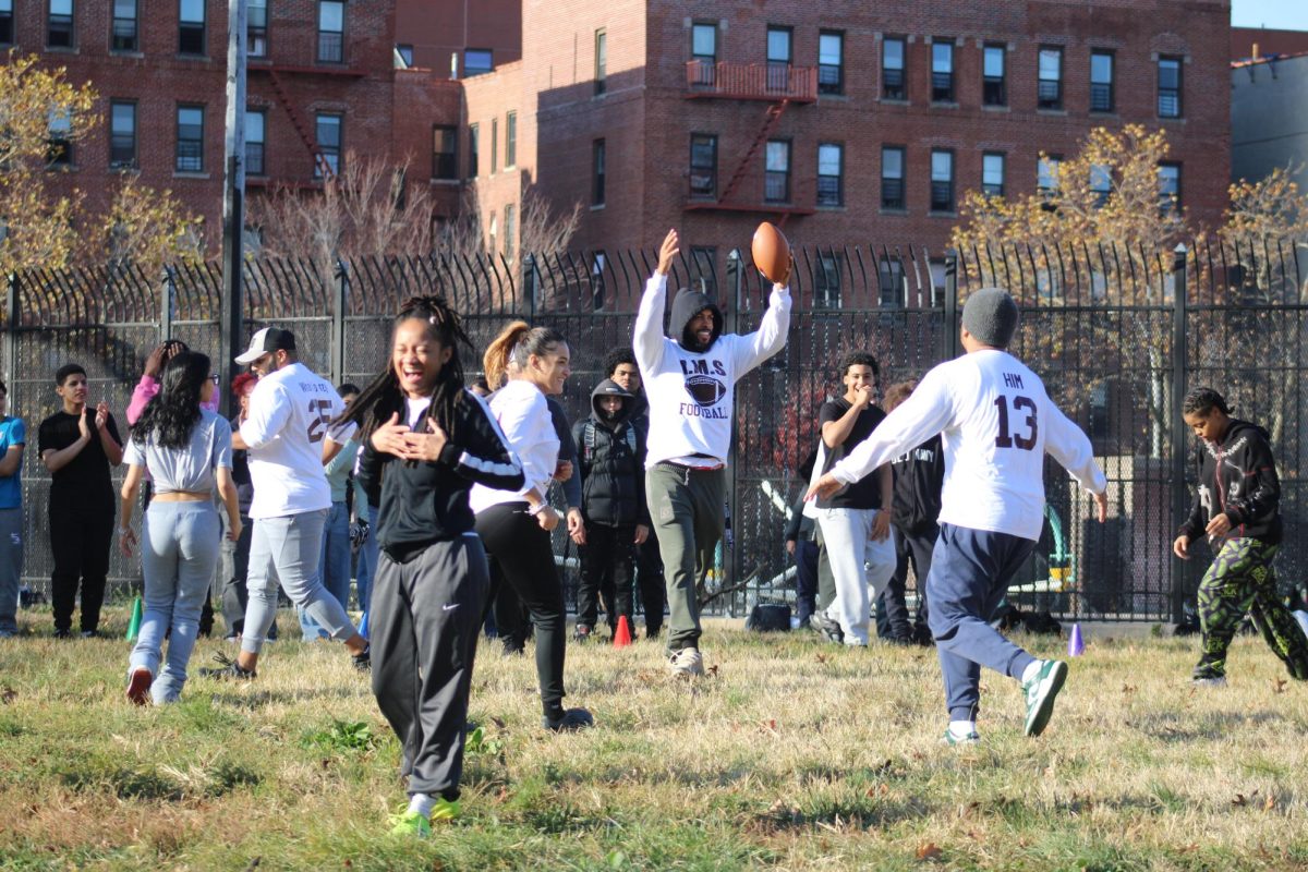 The staff celebrate their first point.