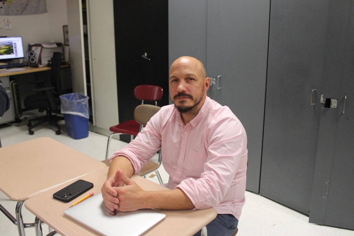 Mr. Schultz at his desk during History class.