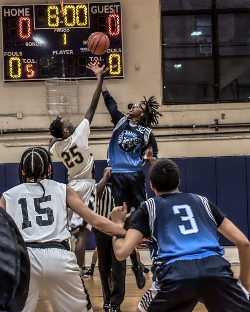 Bathgate (Left) and Walton (Right) players tip-off to start the game.
