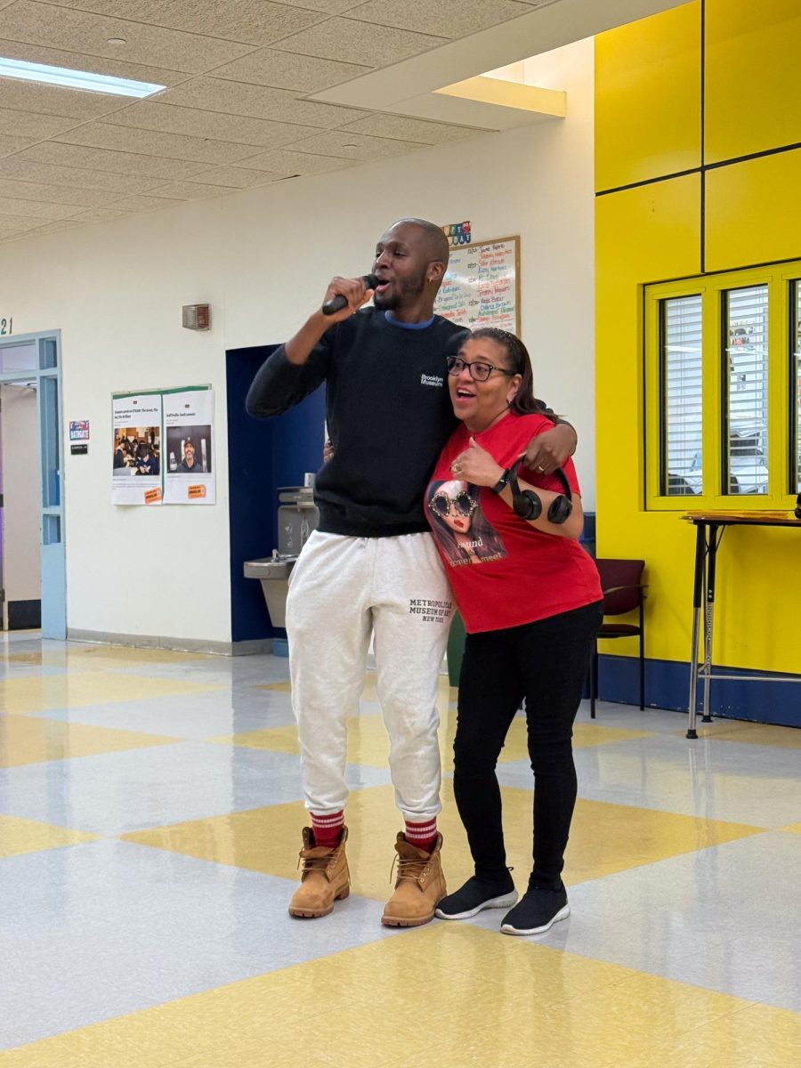 Ms. Herreras joins Mr. Baker in song. 