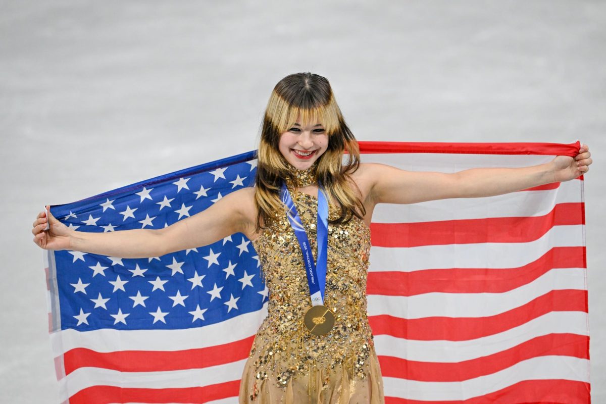 Alyssa Liu posing for a picture february 19th after winning a gold medal in Milan during the olympics